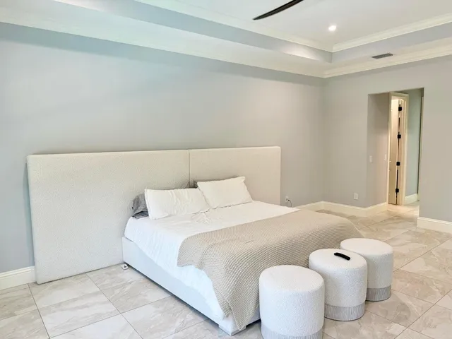 a living room with a bed furniture and a window