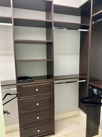 a bathroom with a granite countertop sink mirror bathtub and toilet