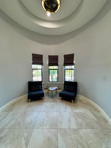 a view of a dining room with furniture window and outside view