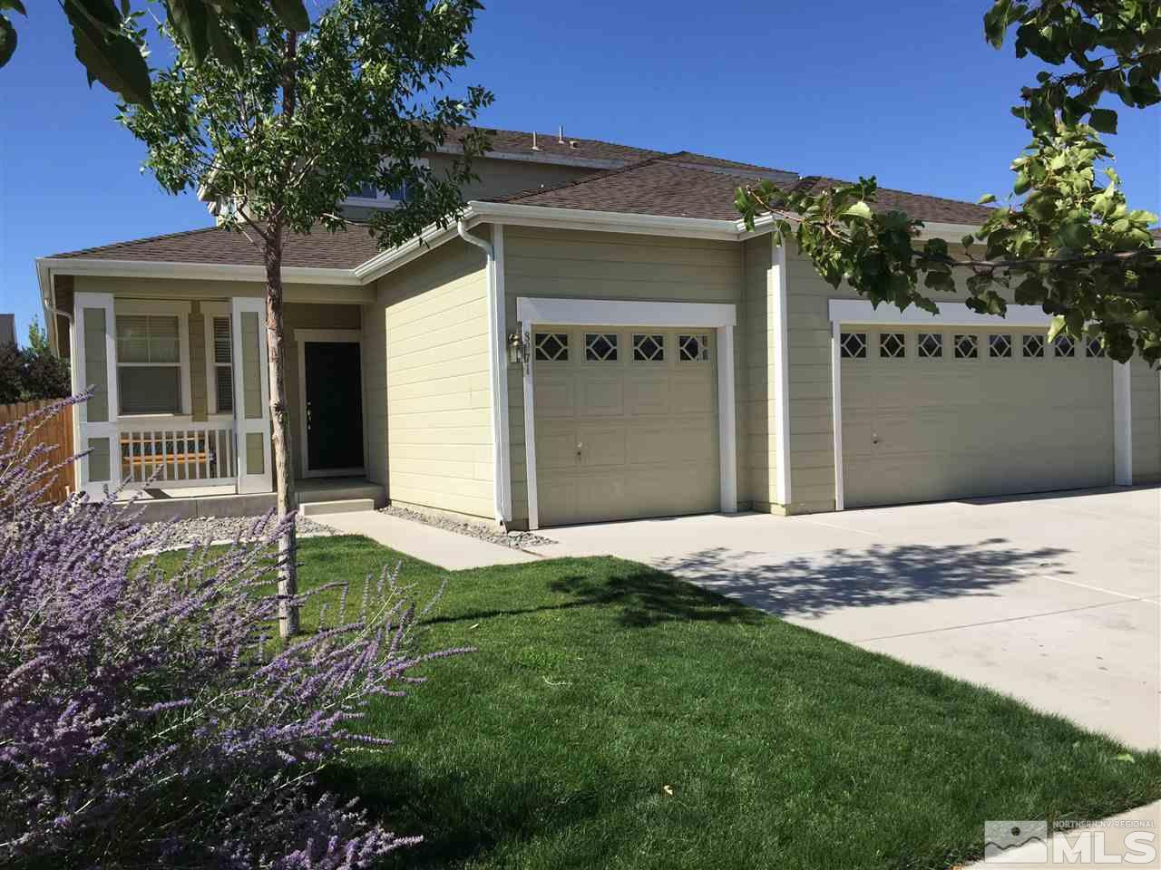 8971 Mahon Drive Reno, NV 89506 - Photo 1 of 1 a house with garden in front of it