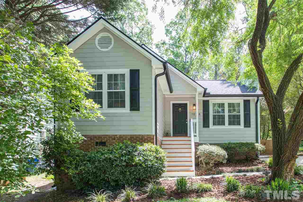 1024 Mills Street Raleigh, NC 27608 - Photo 1 of 30 a front view of a house with garden