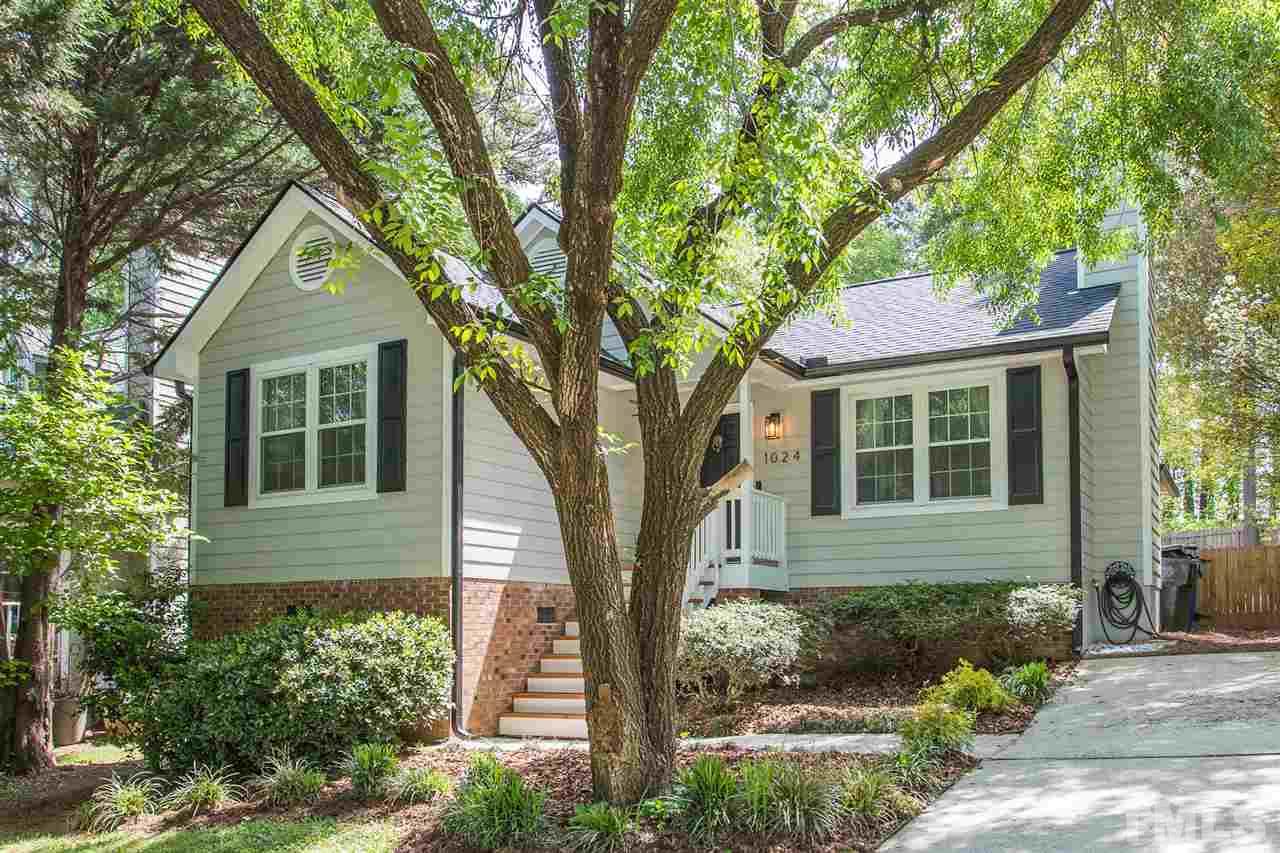 1024 Mills Street Raleigh, NC 27608 - Photo 2 of 30 a front view of a house with garden