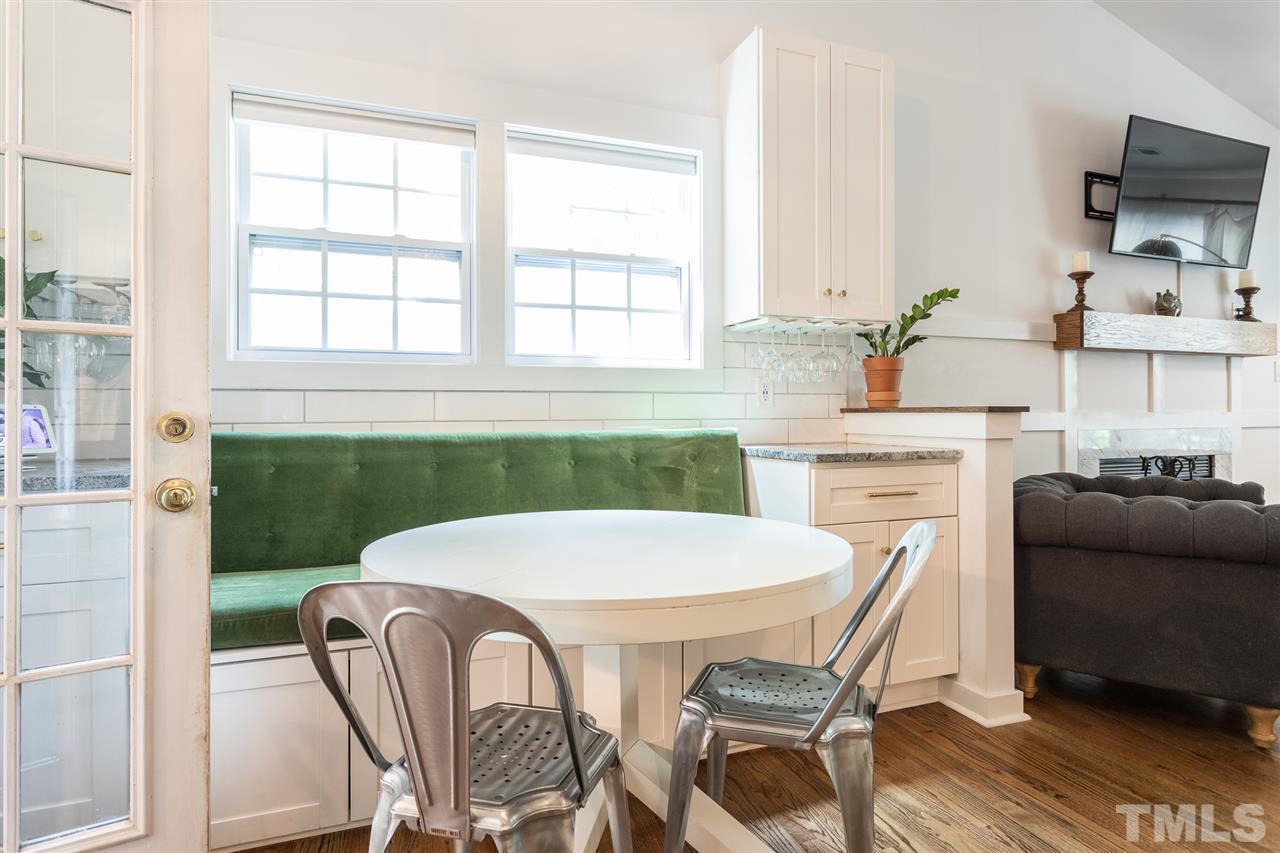 1024 Mills Street Raleigh, NC 27608 - Photo 14 of 30 a table and chairs in a kitchen