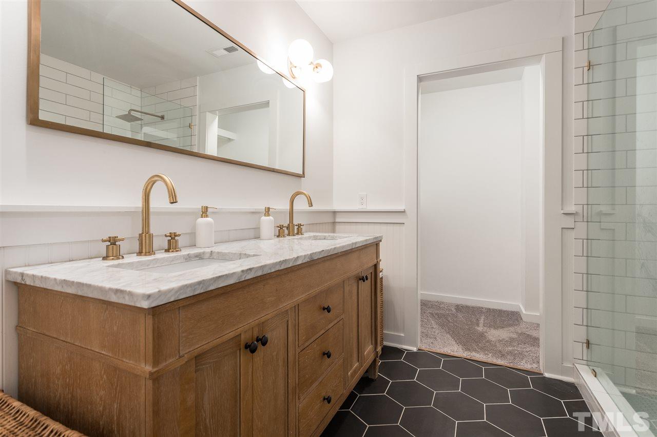 1024 Mills Street Raleigh, NC 27608 - Photo 18 of 30 a bathroom with a sink and a mirror