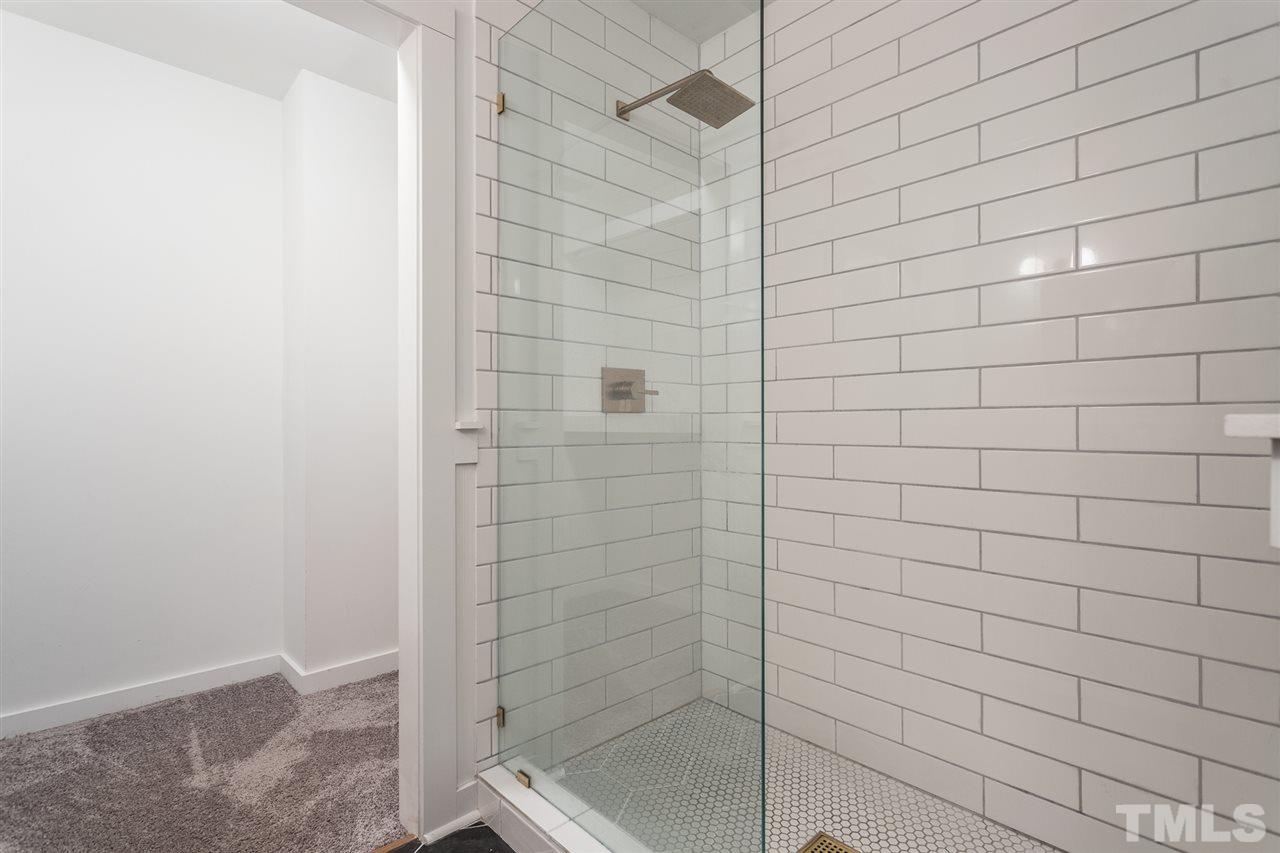 1024 Mills Street Raleigh, NC 27608 - Photo 19 of 30 a bathroom with a shower