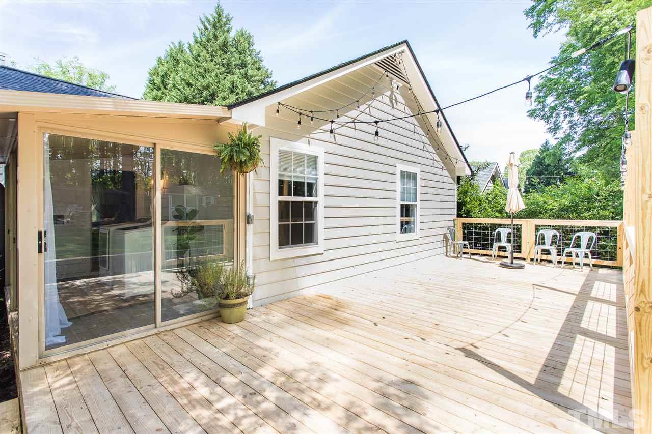 1024 Mills Street Raleigh, NC 27608 - Photo 25 of 30 a view of a house with a backyard