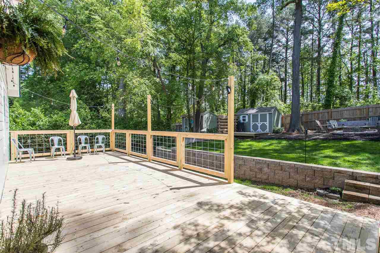 1024 Mills Street Raleigh, NC 27608 - Photo 26 of 30 a view of a yard with wooden fence
