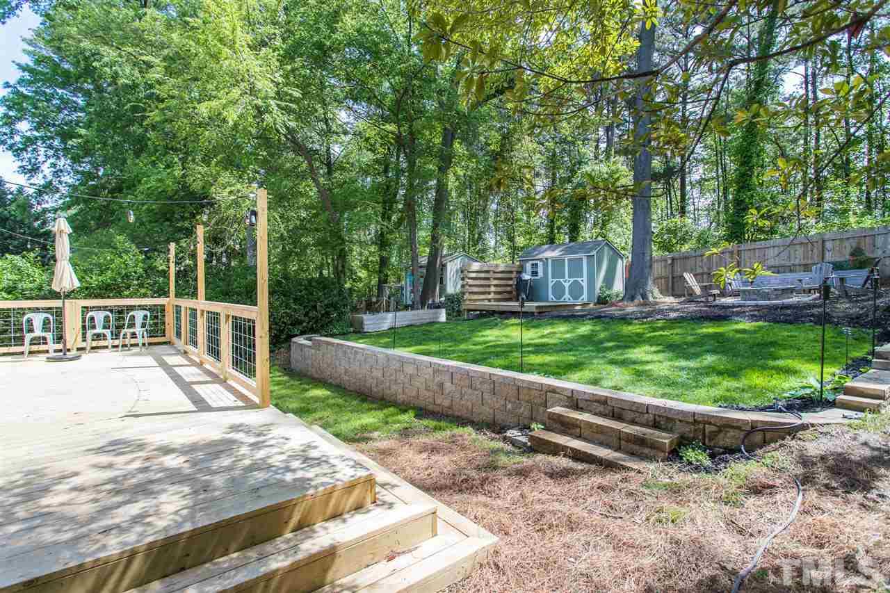 1024 Mills Street Raleigh, NC 27608 - Photo 27 of 30 a view of a house with backyard and sitting area