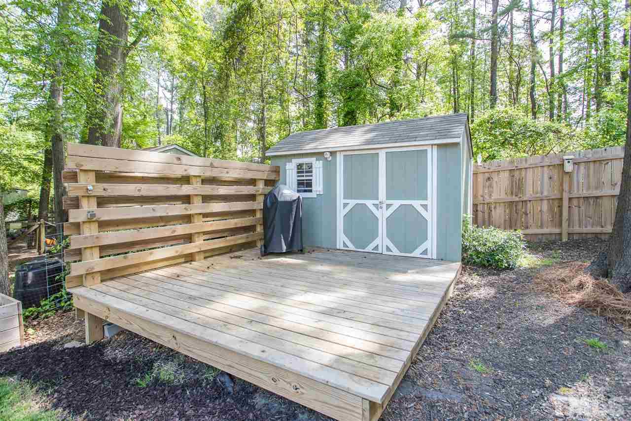 1024 Mills Street Raleigh, NC 27608 - Photo 28 of 30 a view of a house with backyard and a area