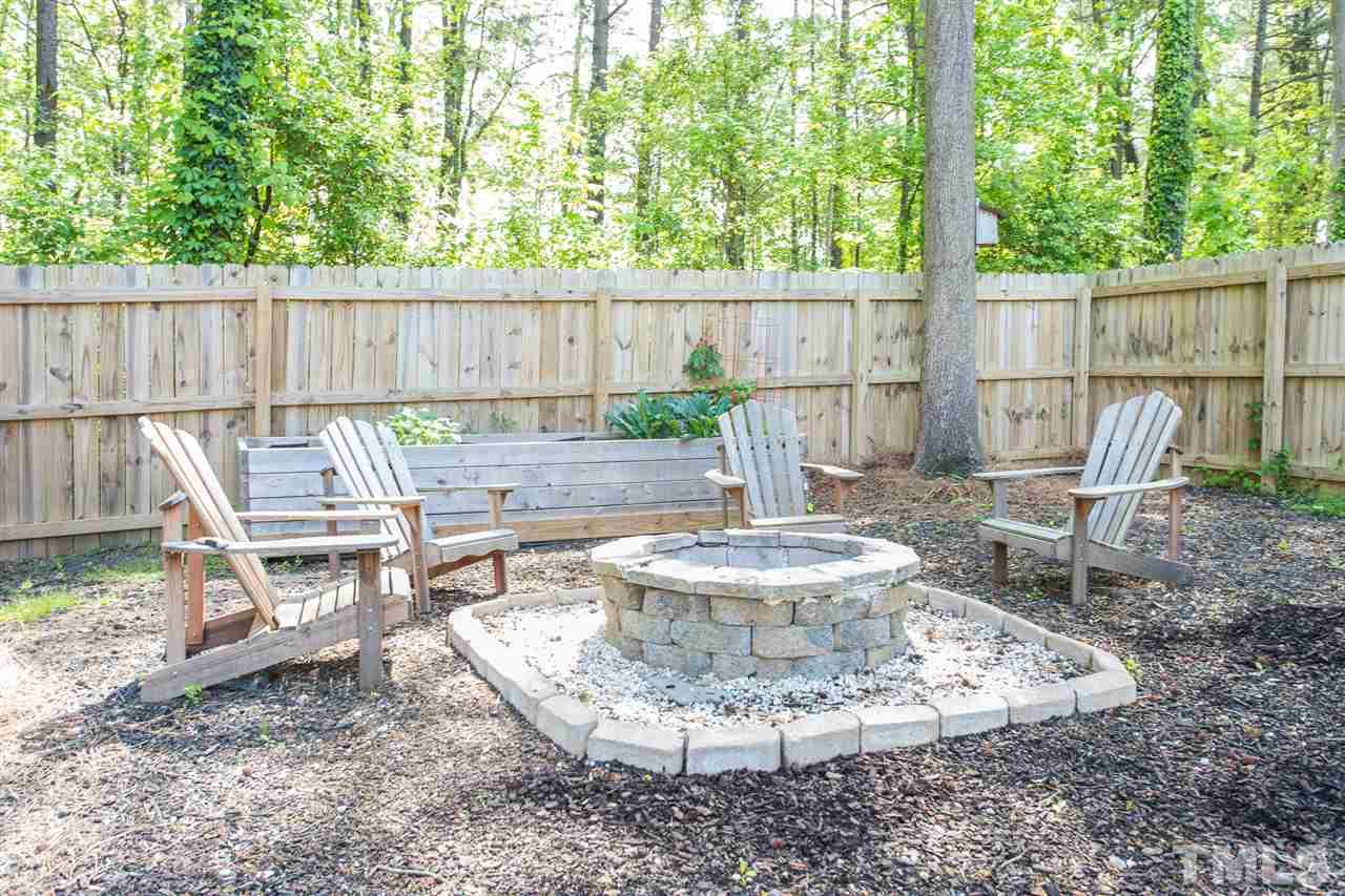 1024 Mills Street Raleigh, NC 27608 - Photo 30 of 30 a view of a backyard with table and chairs
