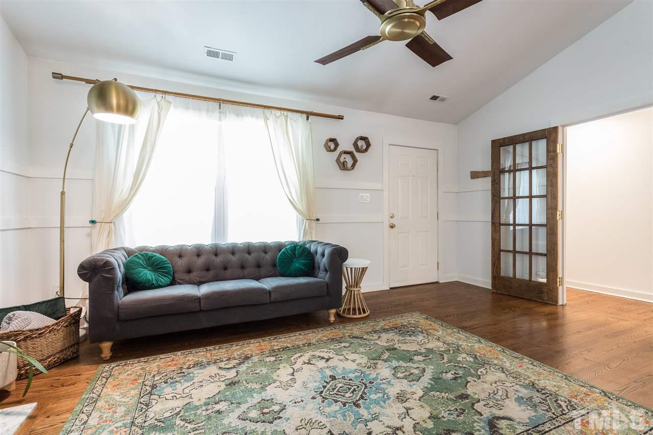 1024 Mills Street Raleigh, NC 27608 - Photo 5 of 30 a living room with furniture and a large window
