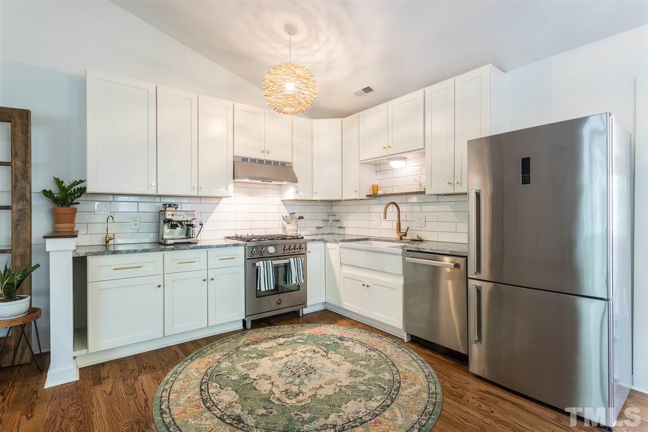 1024 Mills Street Raleigh, NC 27608 - Photo 10 of 30 a kitchen with a sink stove and refrigerator
