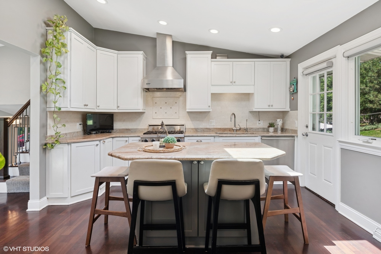 551 Dundee Road Glencoe, IL 60022 - Photo 12 of 38 a kitchen with stainless steel appliances granite countertop a table chairs refrigerator and microwave
