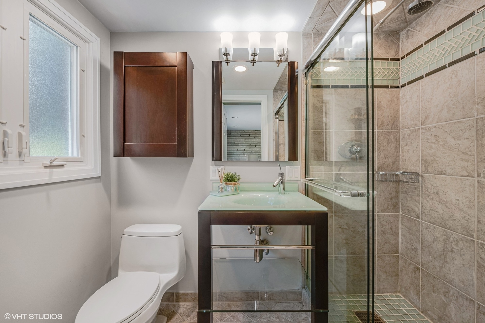 551 Dundee Road Glencoe, IL 60022 - Photo 16 of 38 a bathroom with a toilet sink and mirror