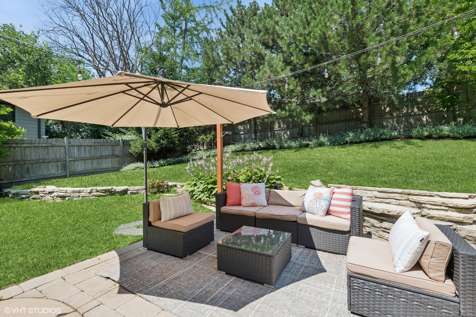551 Dundee Road Glencoe, IL 60022 - Photo 31 of 38 a view of a patio with couches under an umbrella