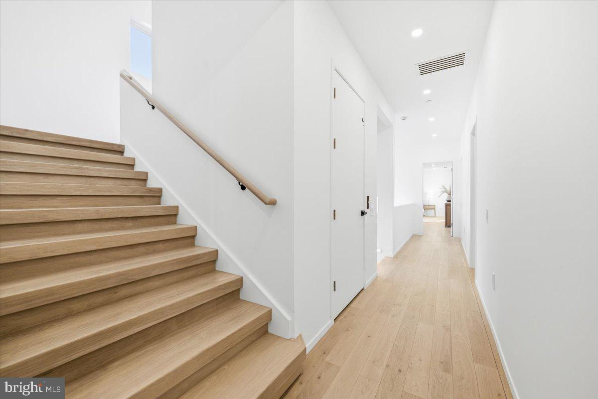 7502 Nevis Road Bethesda, MD 20817 - Photo 55 of 83 a view of a hallway with stairs