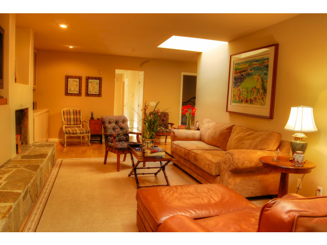 3059 Aztec Road Pebble Beach, CA 93953 - Photo 13 of 24 a living room with furniture and a lamp