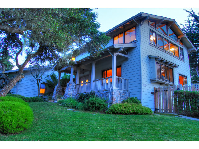 3059 Aztec Road Pebble Beach, CA 93953 - Photo 3 of 24 a front view of a house with a yard