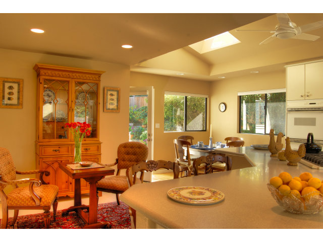3059 Aztec Road Pebble Beach, CA 93953 - Photo 10 of 24 a living room with furniture a large window and a dining table