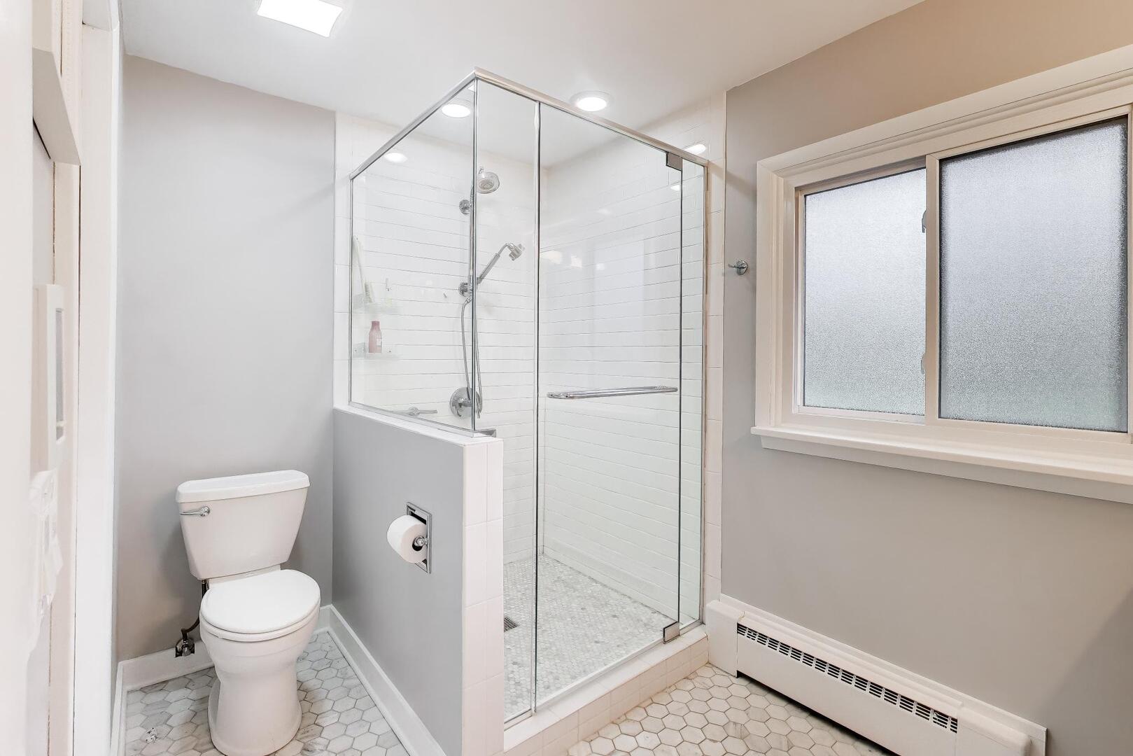 202 Grove Place Prospect Heights, IL 60070 - Photo 18 of 34 a bathroom with a granite countertop sink toilet and shower