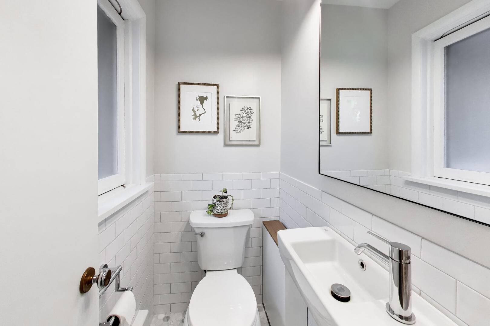 202 Grove Place Prospect Heights, IL 60070 - Photo 25 of 34 a white toilet sitting next to a bathroom sink
