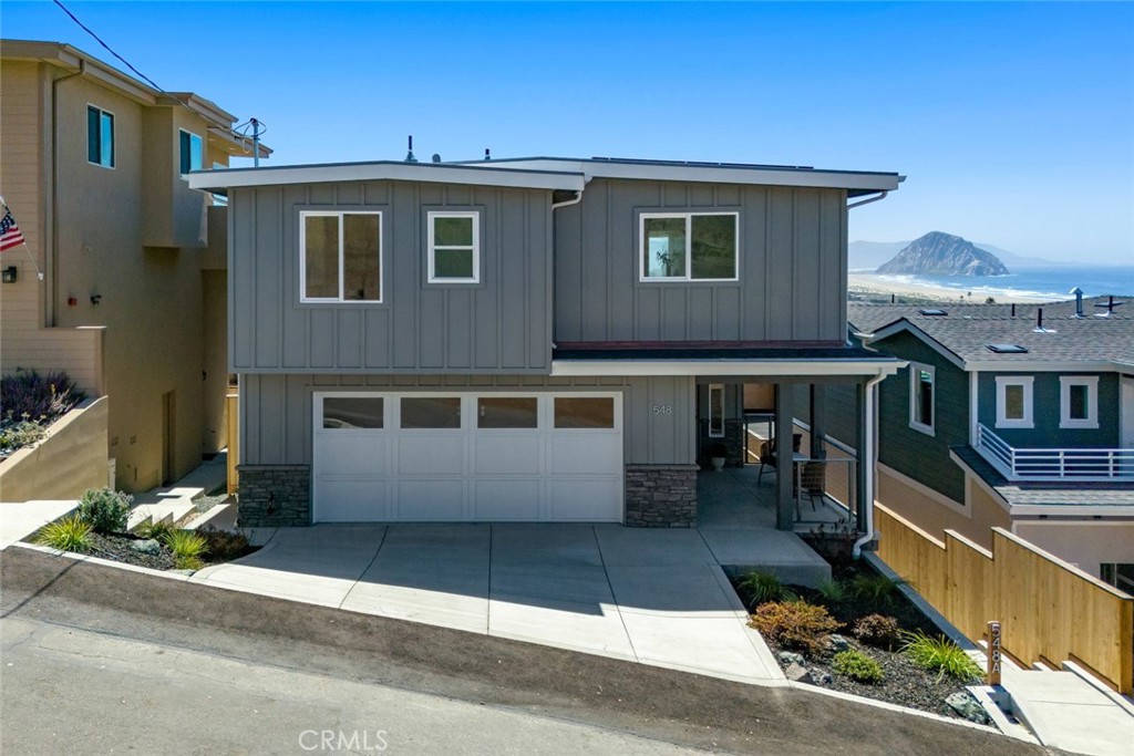 548 Blanca Street Morro Bay, CA 93442 - Photo 2 of 50 a front view of a house with windows
