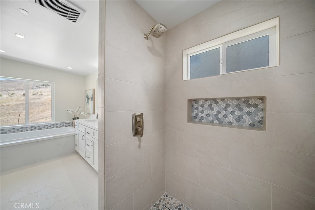548 Blanca Street Morro Bay, CA 93442 - Photo 23 of 50 a bathroom with a granite countertop sink a toilet and shower