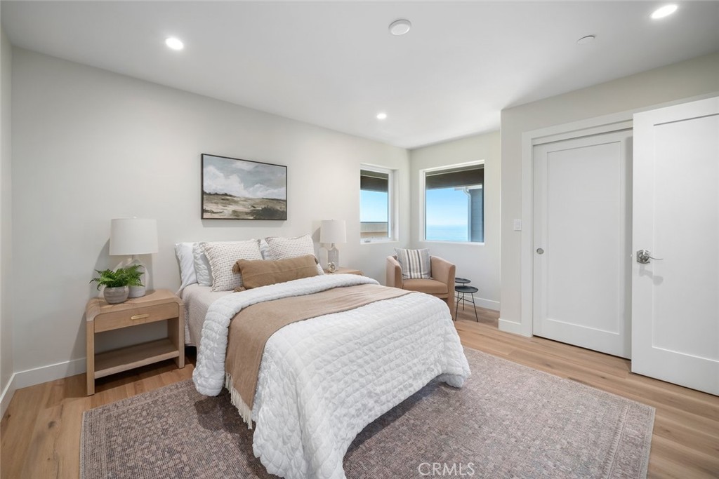 548 Blanca Street Morro Bay, CA 93442 - Photo 26 of 50 a bed room with a bed and a painting