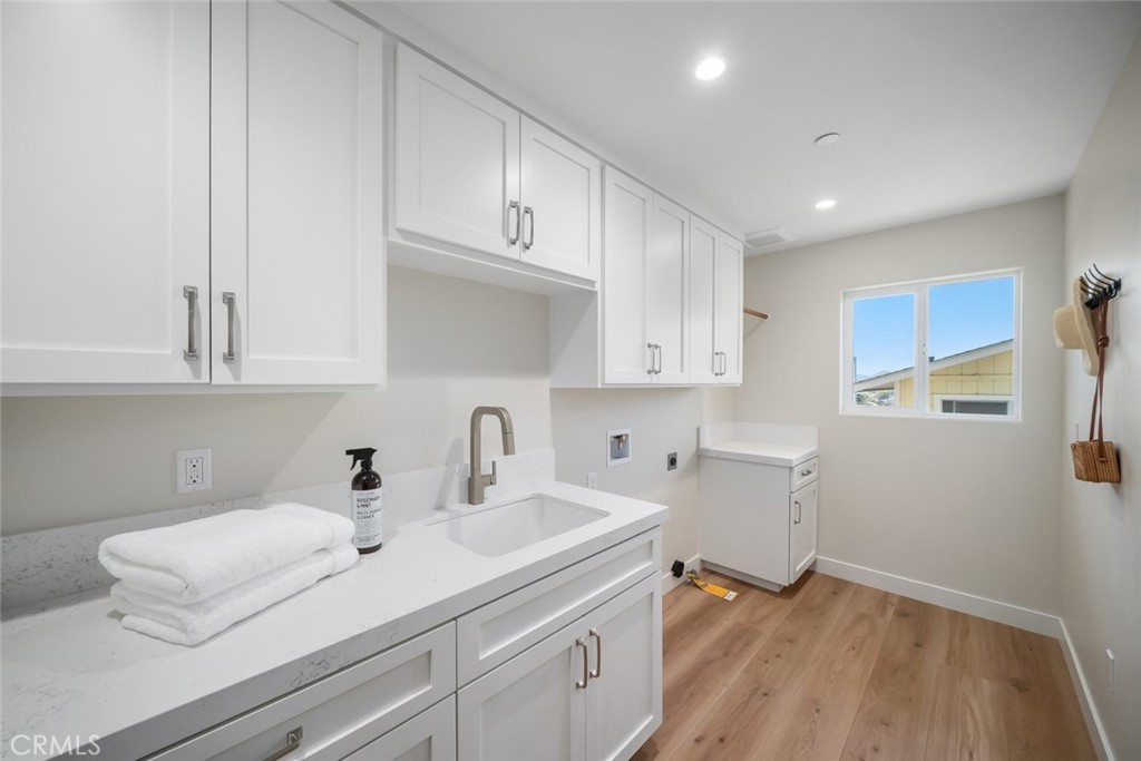 548 Blanca Street Morro Bay, CA 93442 - Photo 30 of 50 a kitchen with a sink cabinets and a window