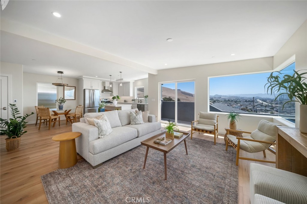 548 Blanca Street Morro Bay, CA 93442 - Photo 5 of 50 a living room with furniture and a large window