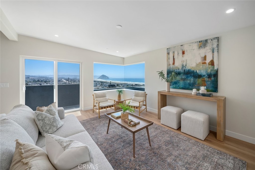 548 Blanca Street Morro Bay, CA 93442 - Photo 6 of 50 a living room with furniture and a large window