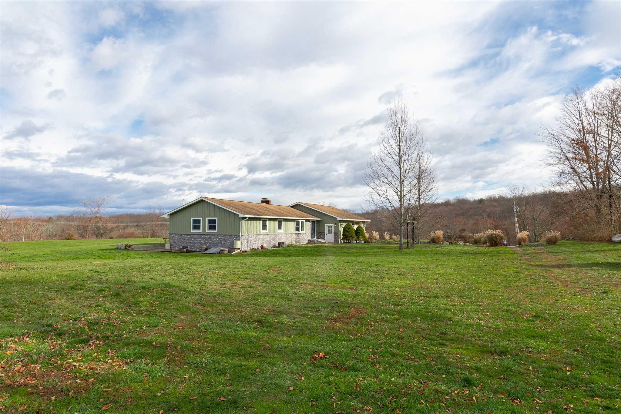 a view of a big yard with a house