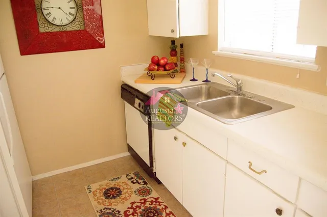 a living room with a rug