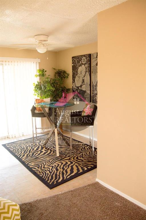 2800 Sayles Boulevard, Unit 19B Abilene, TX 79605 - Photo 12 of 12 a living room with a rug