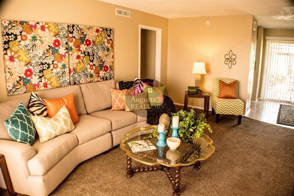 2800 Sayles Boulevard, Unit 19B Abilene, TX 79605 - Photo 4 of 12 a living room with furniture and a large window