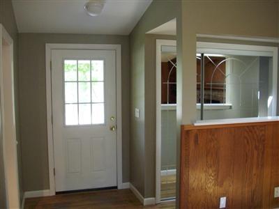 106 Seabrook Road Hyannis, MA 02601 - Photo 5 of 10 an entryway with wooden floor and windows