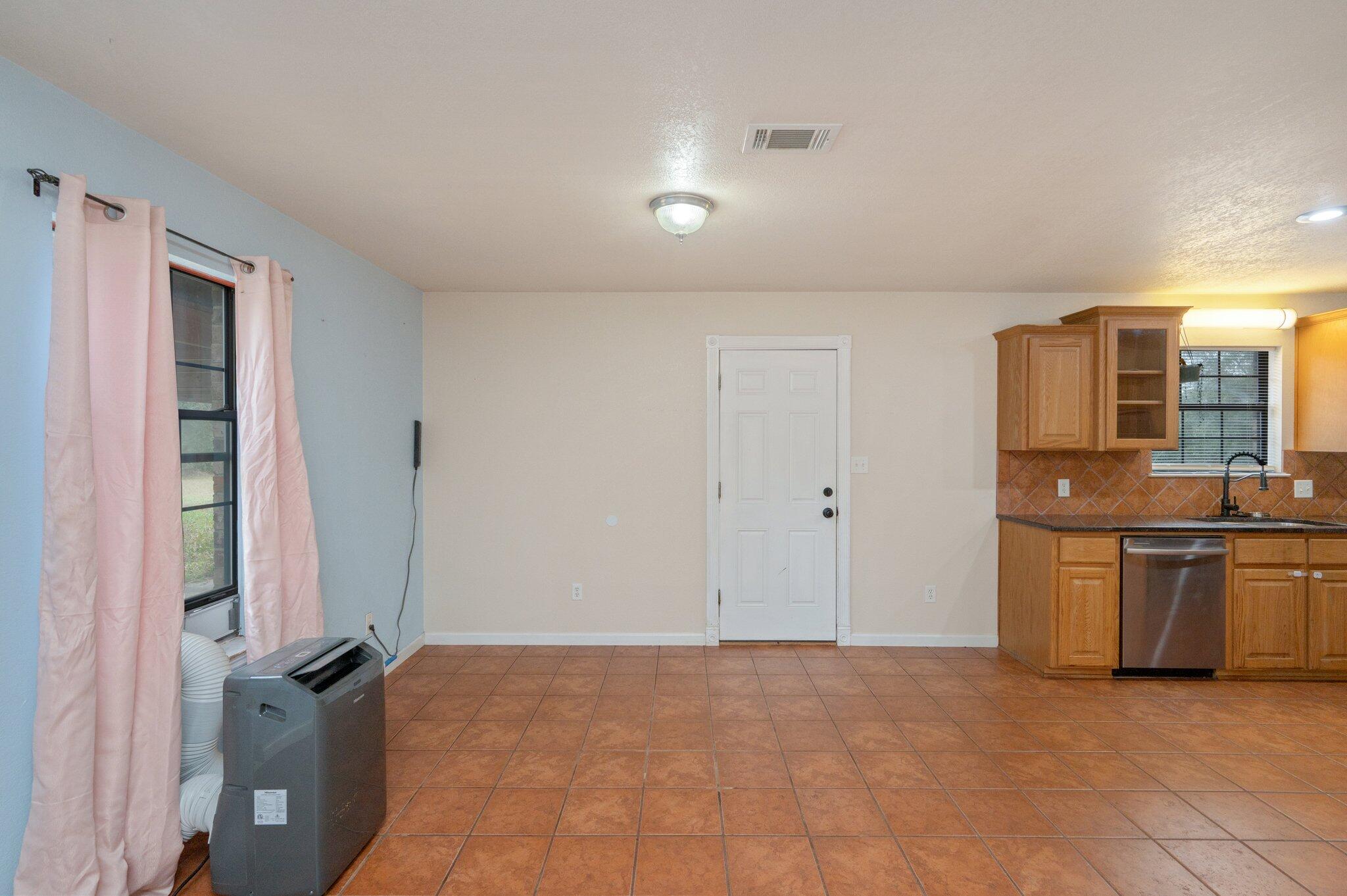 5369 Pecos Pass Gulf Breeze, FL 32563 - Photo 14 of 26 a view of a kitchen with a sink and cabinets