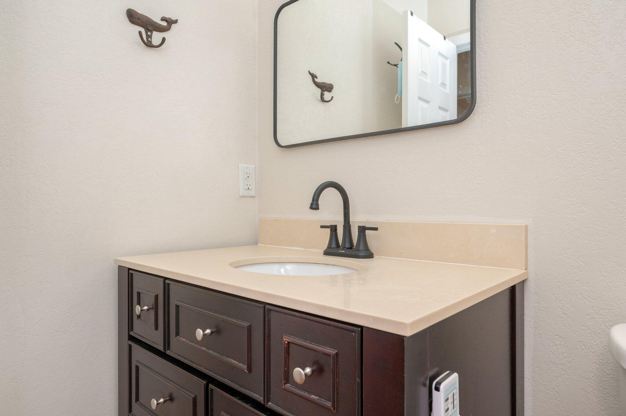 5369 Pecos Pass Gulf Breeze, FL 32563 - Photo 15 of 26 a utility room with a sink and a mirror