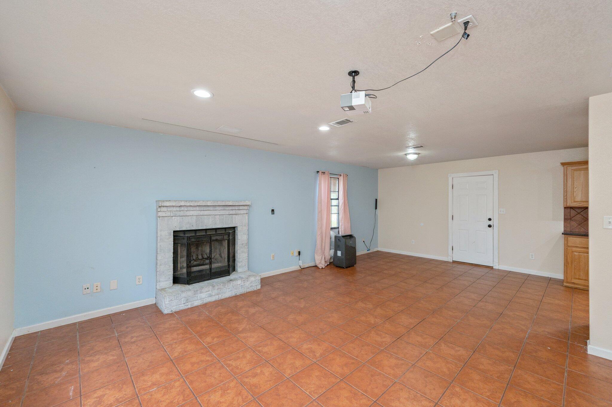 5369 Pecos Pass Gulf Breeze, FL 32563 - Photo 20 of 26 a view of an empty room with a fireplace and a window