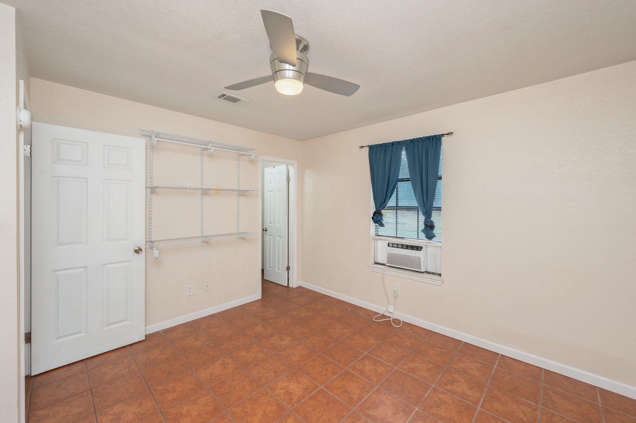 5369 Pecos Pass Gulf Breeze, FL 32563 - Photo 21 of 26 a view of a big room with closet and chandelier fan
