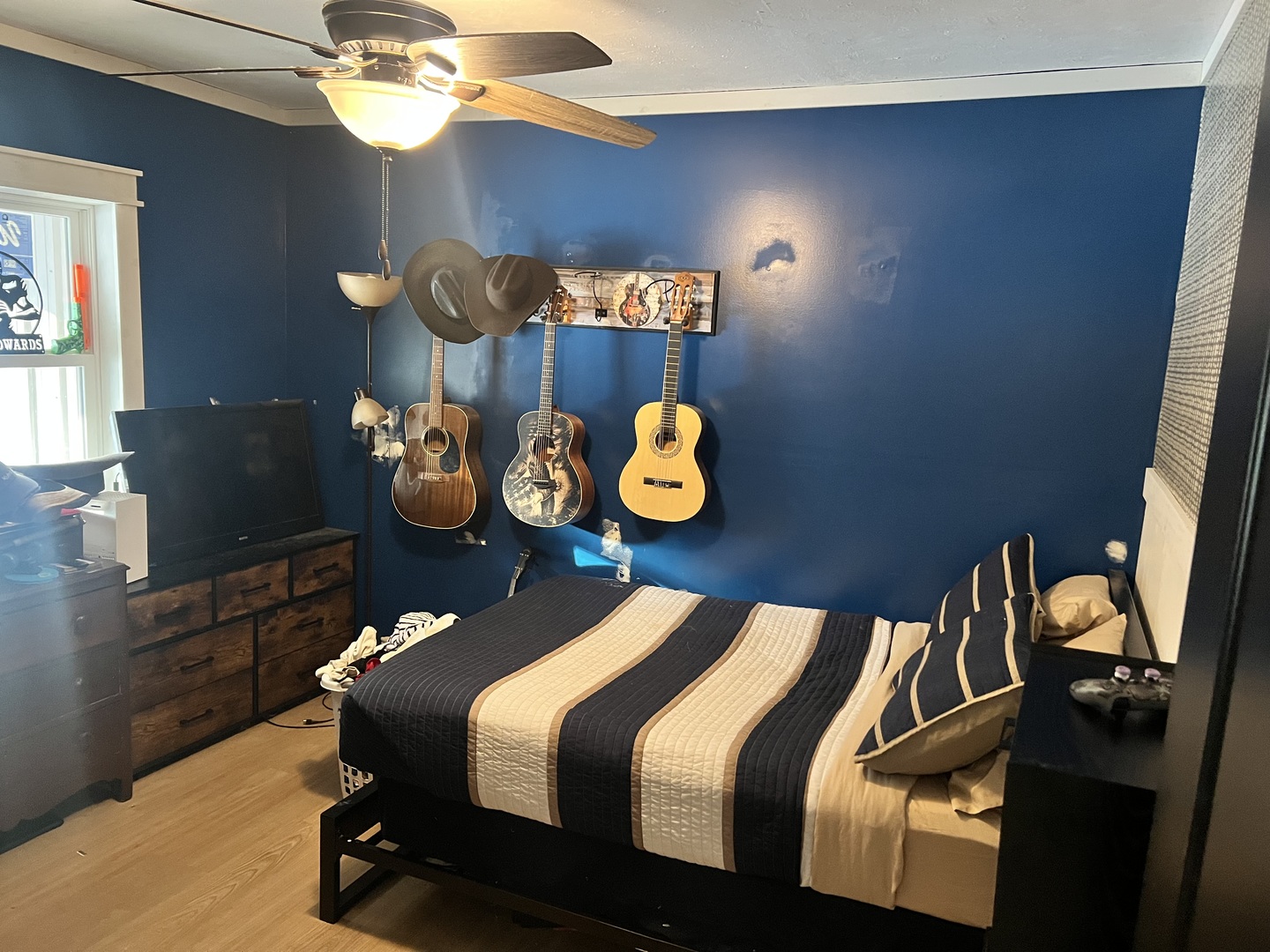 601 North 6th Street Vienna, IL 62995 - Photo 14 of 19 a bedroom with a bed and a chandelier