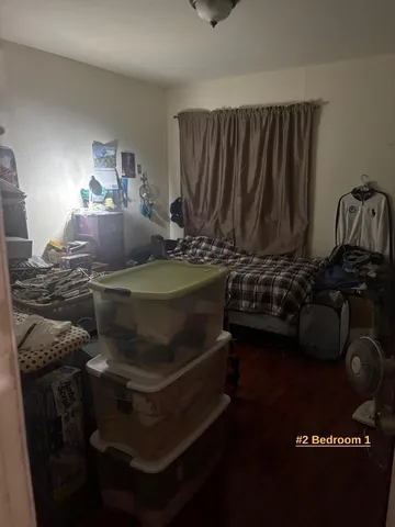 a bedroom with a bed and wall painting