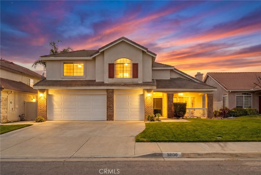 32130 Corte Parado Temecula, CA 92592 - Photo 1 of 1 a front view of a house with a yard and garage