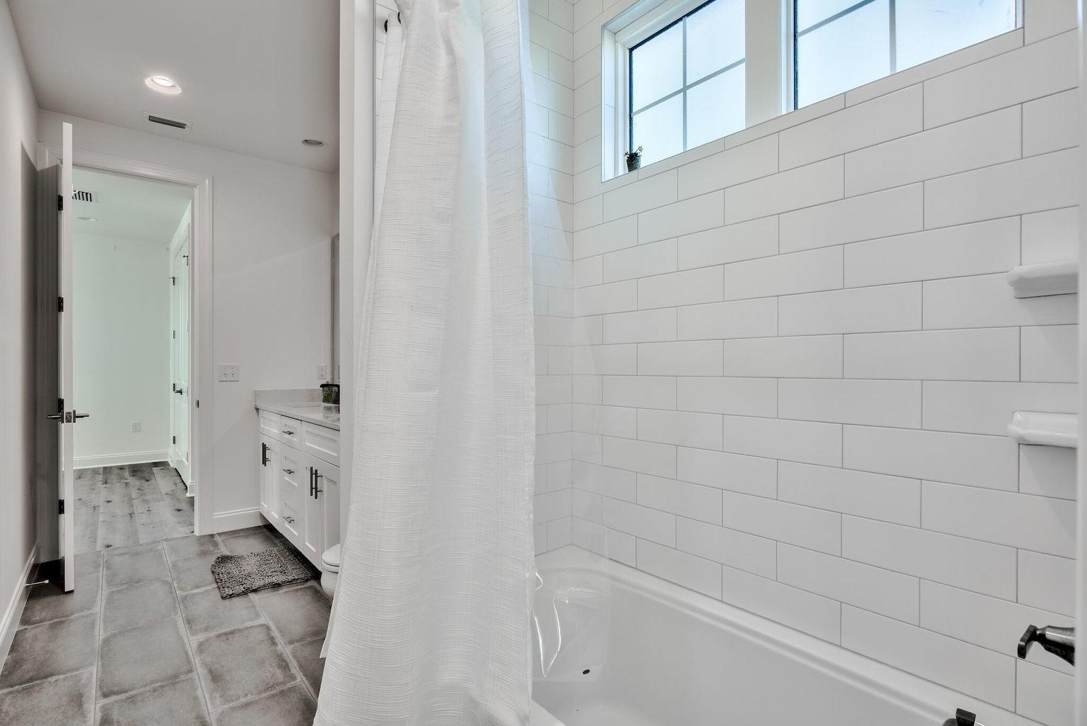 25 Cambium Ct Inlet Beach Inlet Beach, FL 32461 - Photo 21 of 29 a bathroom with a bathtub and a shower