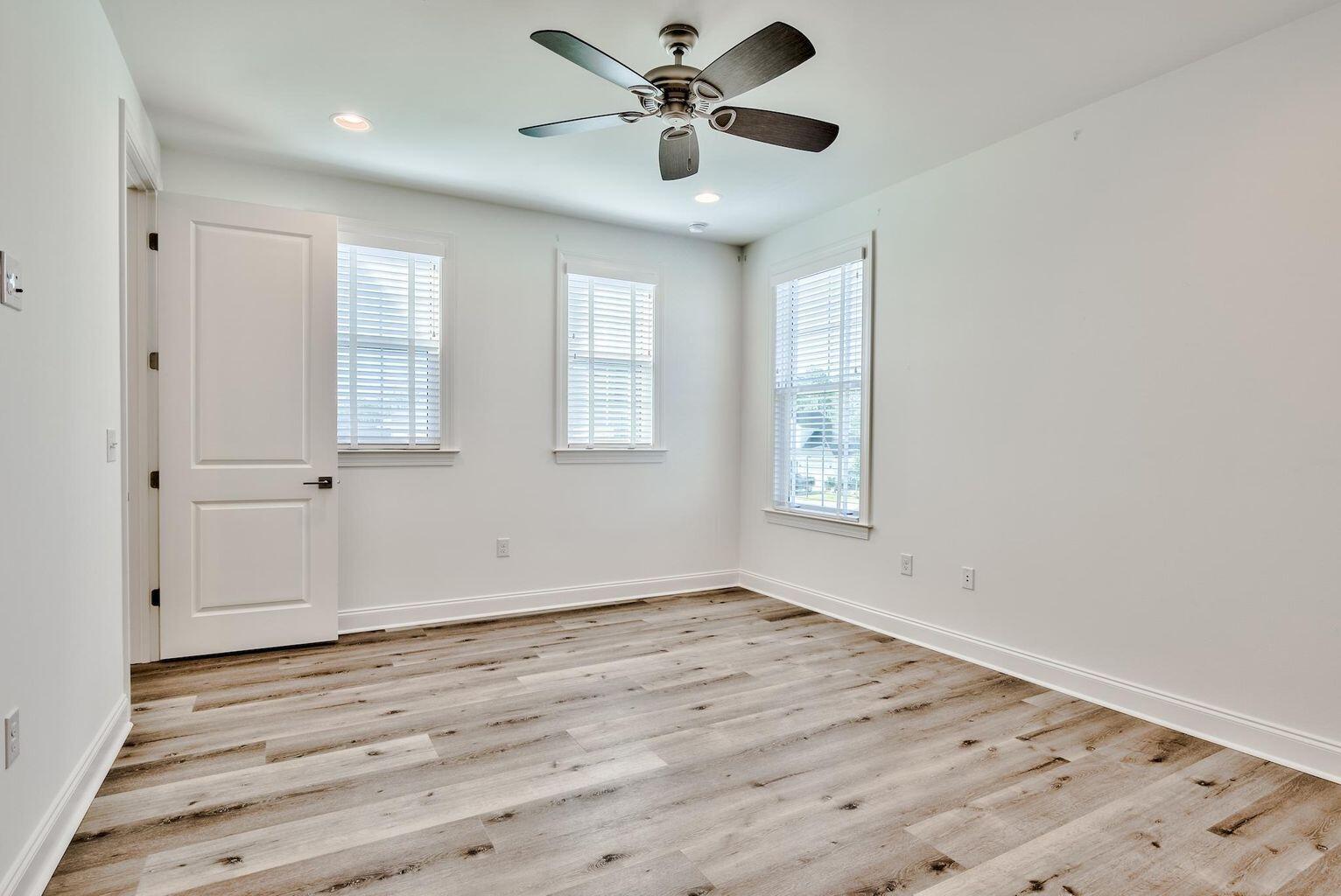 25 Cambium Ct Inlet Beach Inlet Beach, FL 32461 - Photo 23 of 29 a view of an empty room with window and wooden floor