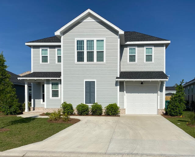 25 Cambium Ct Inlet Beach Inlet Beach, FL 32461 - Photo 4 of 29 a front view of a house with a yard and garage