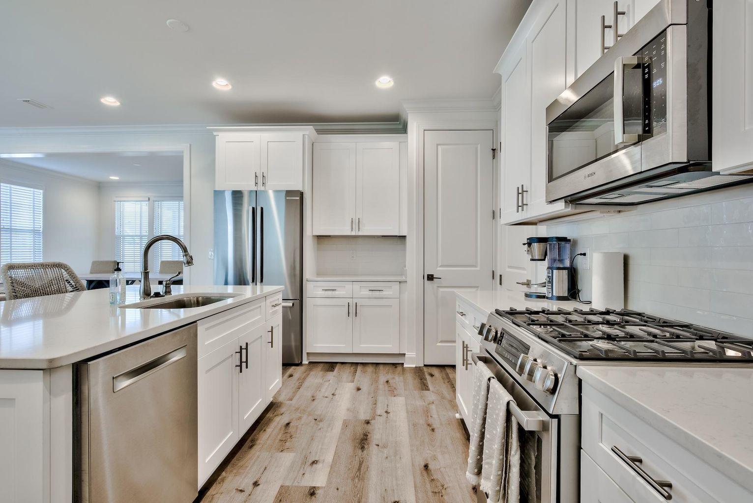 25 Cambium Ct Inlet Beach Inlet Beach, FL 32461 - Photo 6 of 29 a kitchen with stainless steel appliances a sink stove and cabinets