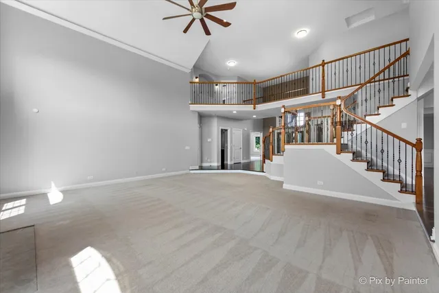 a kitchen with stainless steel appliances granite countertop a sink a stove and a wooden floors