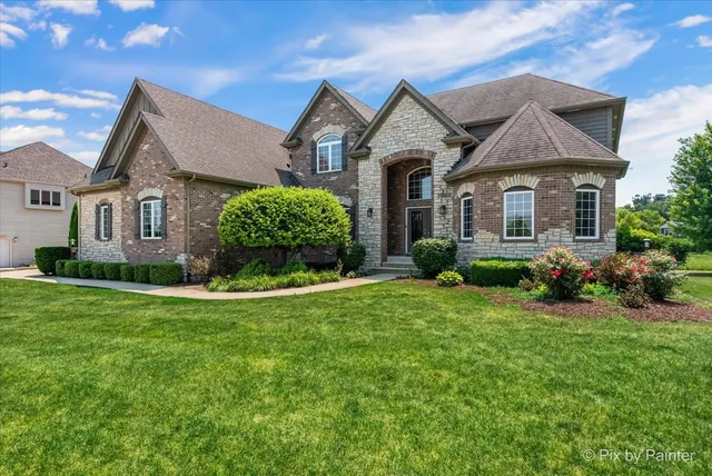 front view of a house with a yard