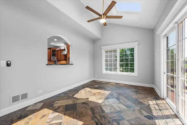 a view of an empty room with a window